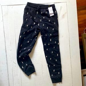 Black with white lightening bolt kids joggers age 8. Brand new.